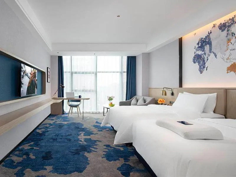 Bed in Kyriad Marvelous Hotel Fangchenggang Administration Center High-Speed Railway Station