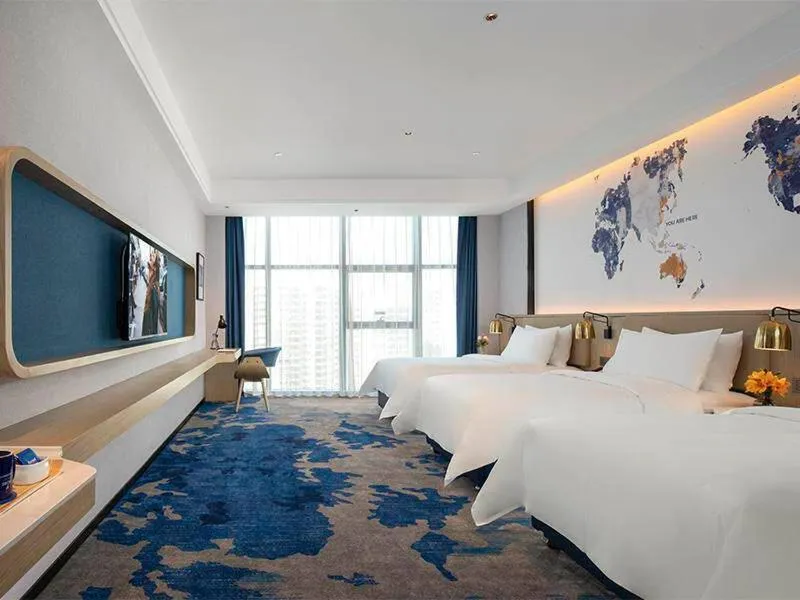 Bed in Kyriad Marvelous Hotel Fangchenggang Administration Center High-Speed Railway Station