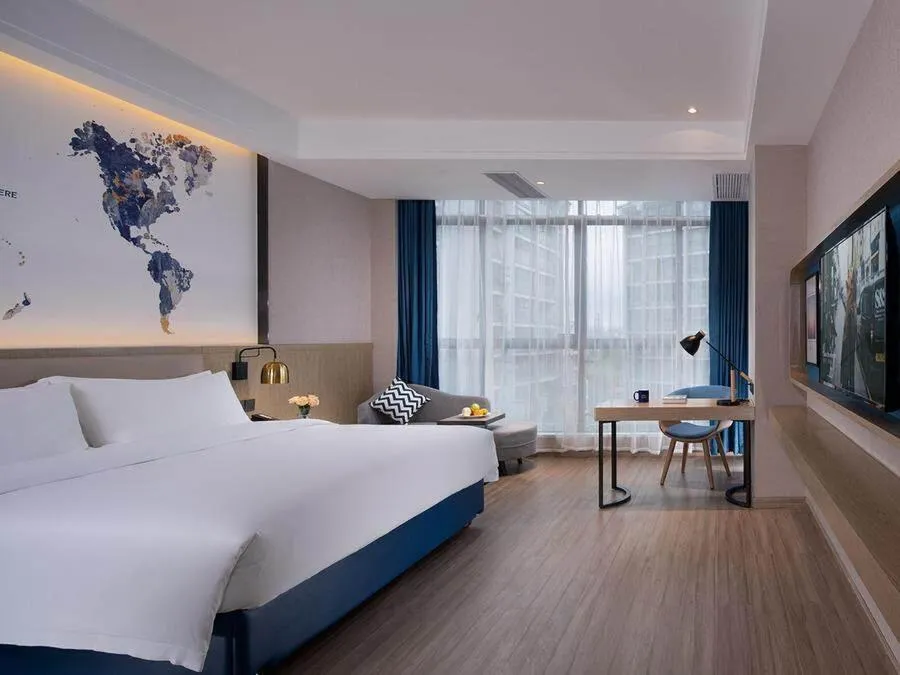 Bed in Kyriad Marvelous Hotel Hezhou Wanda Plaza