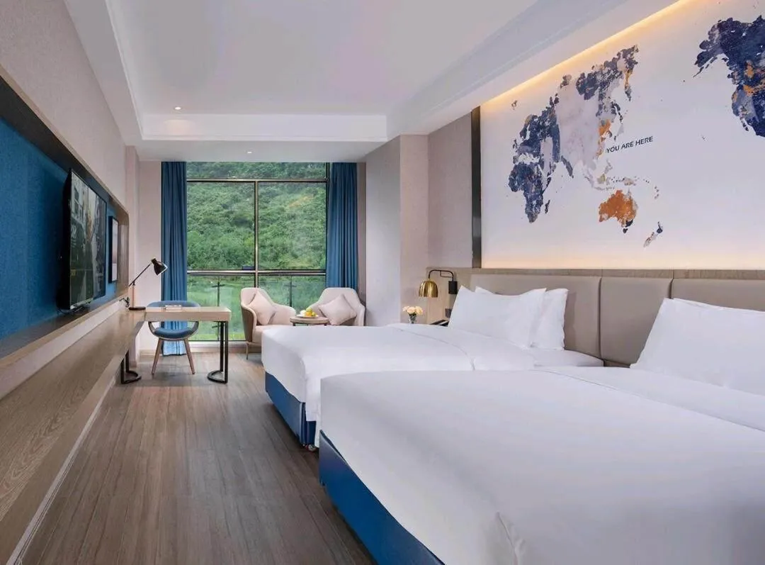 Bed in Kyriad Marvelous Hotel Hezhou Wanda Plaza