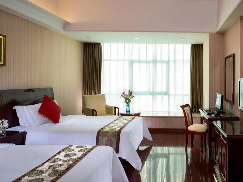 Bed in Vienna Hotel Shenzhen Yousong Branch