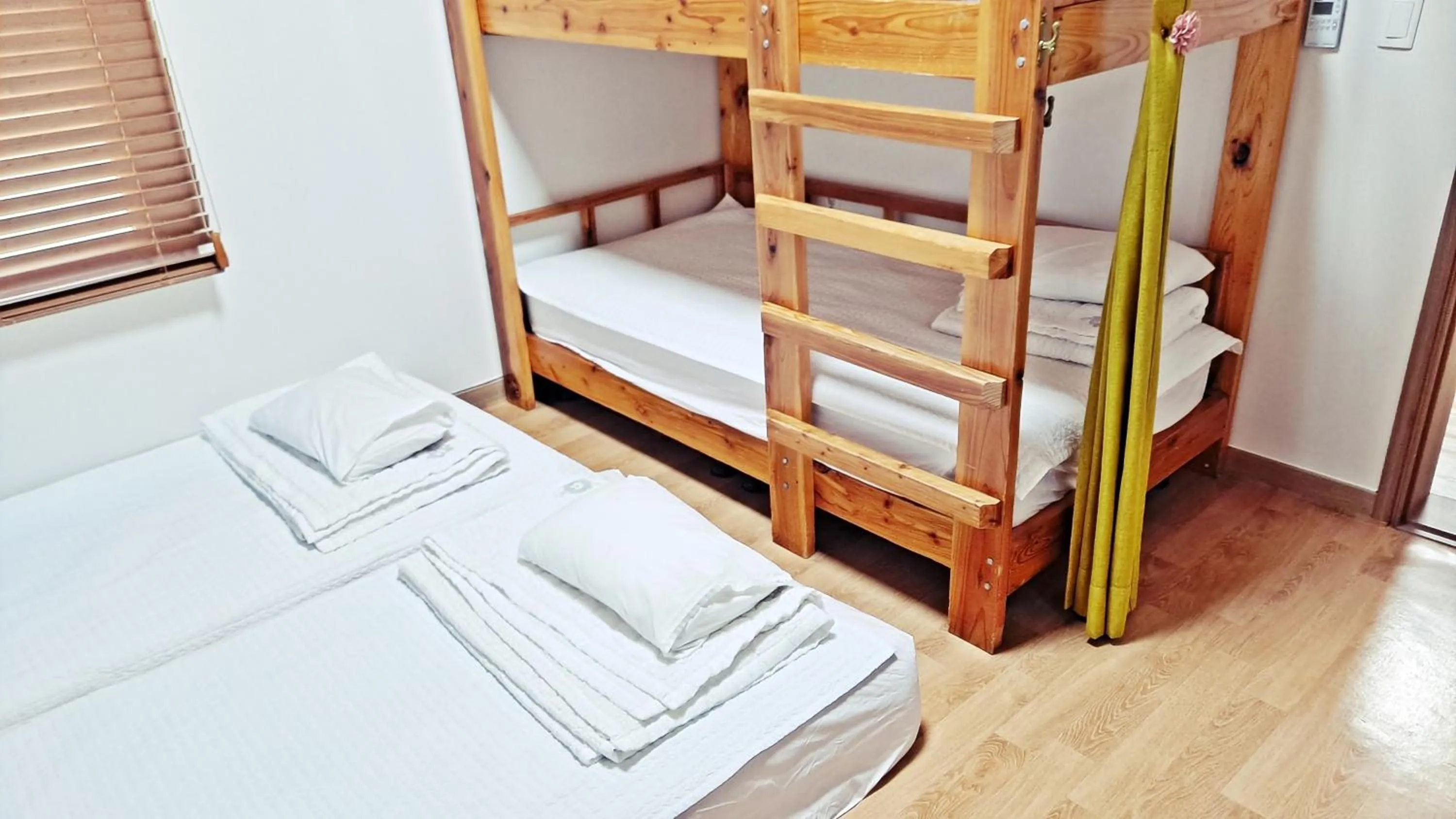 Bed in Jeju Gillime Pension