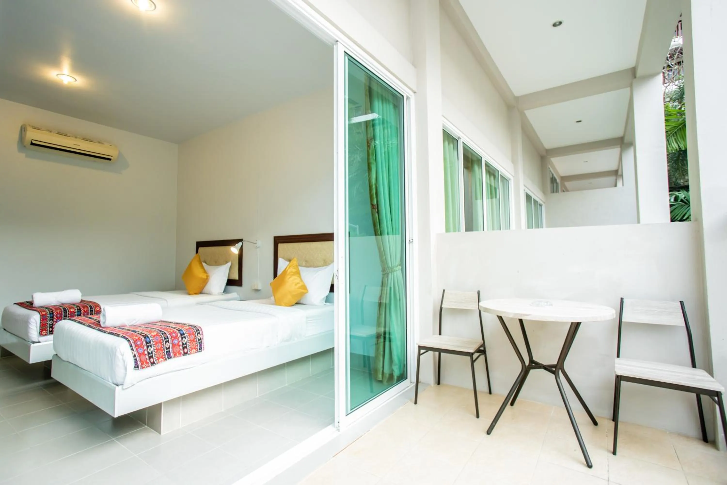 Dining area, Bed in Tri's Miracle Kata Beach Side