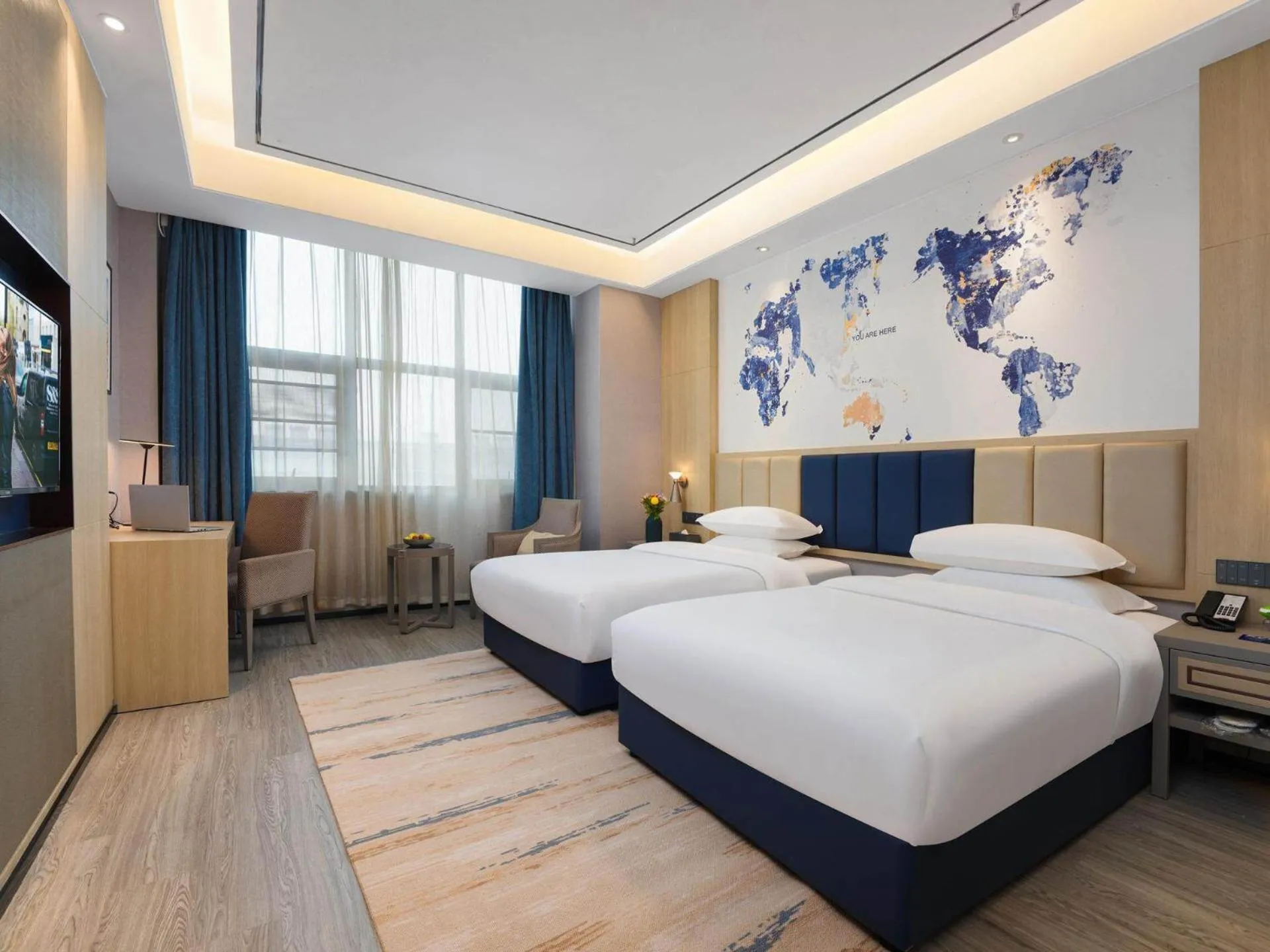 Bed in Kyriad Hotel Baoying Jinyuan Square High-speed Railway Station