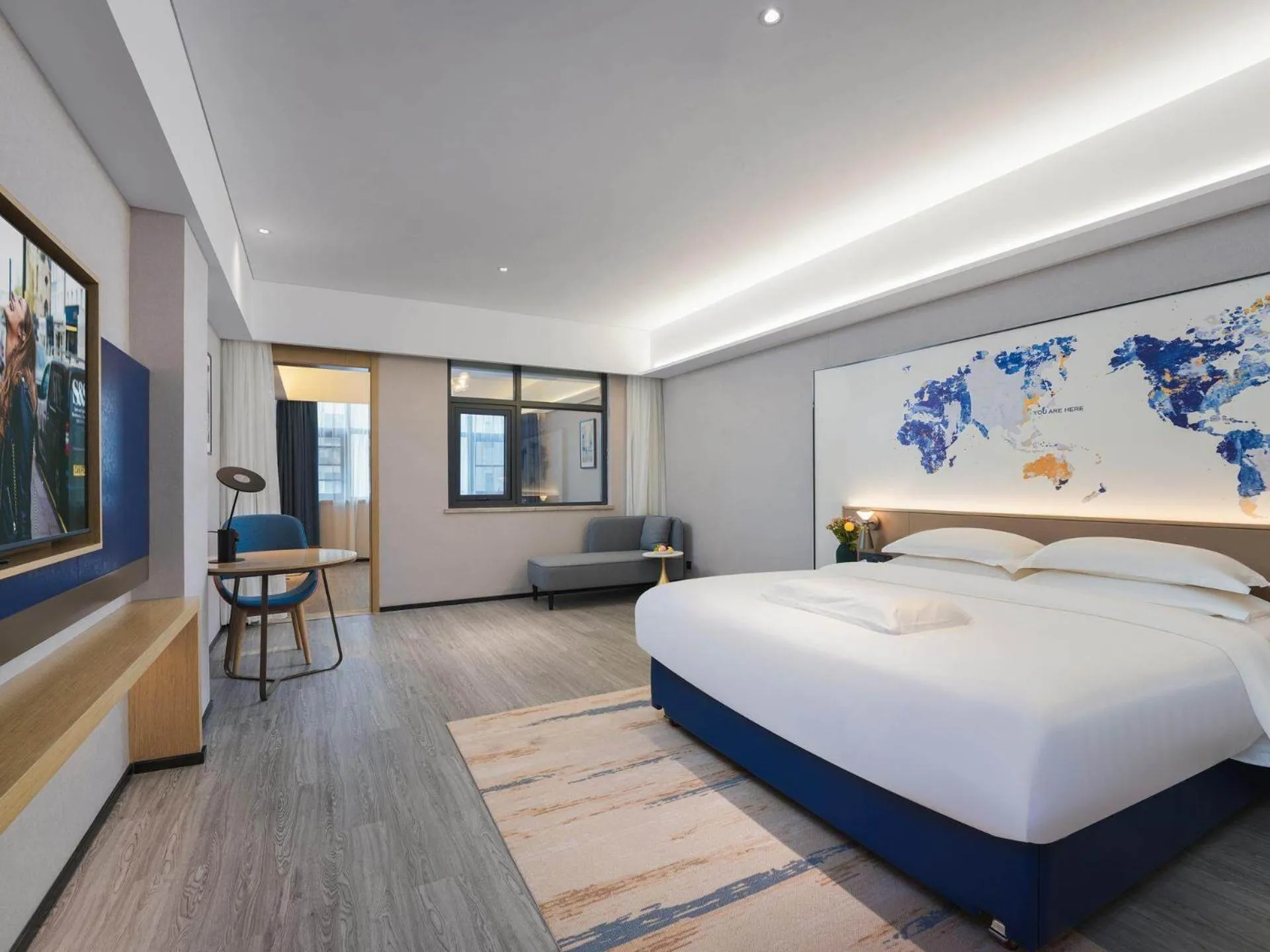 Bed in Kyriad Hotel Baoying Jinyuan Square High-speed Railway Station