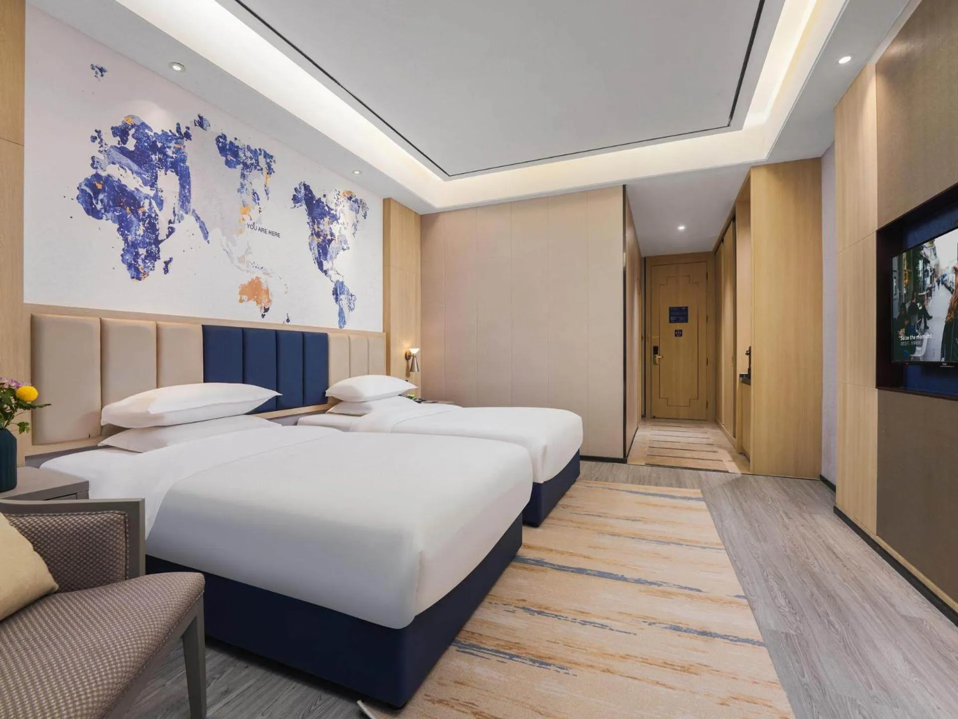 Bed in Kyriad Hotel Baoying Jinyuan Square High-speed Railway Station