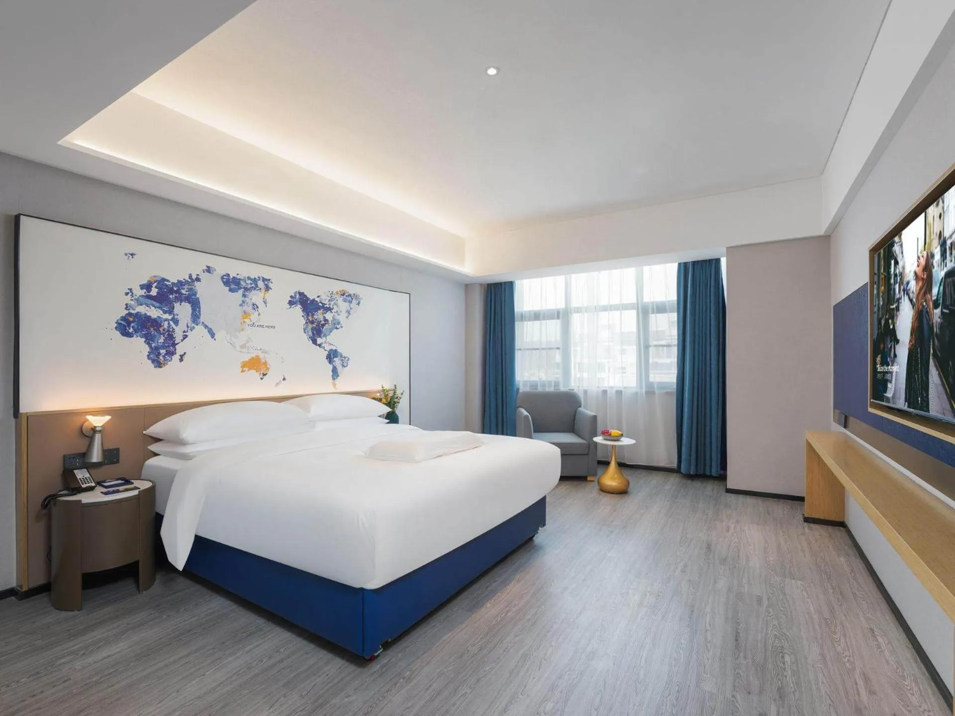 Bed in Kyriad Hotel Baoying Jinyuan Square High-speed Railway Station