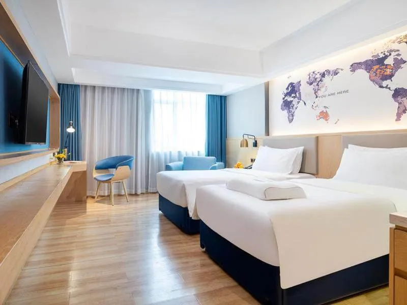 Bed in Kyriad Marvelous Hotel Dongguan Changan Light Rail Station