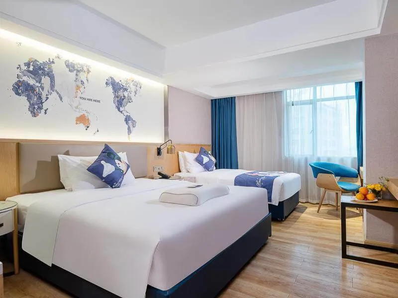 Bed in Kyriad Marvelous Hotel Dongguan Changan Light Rail Station