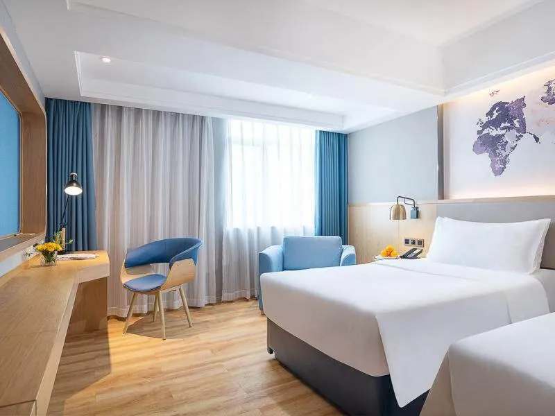 Bed in Kyriad Marvelous Hotel Dongguan Changan Light Rail Station