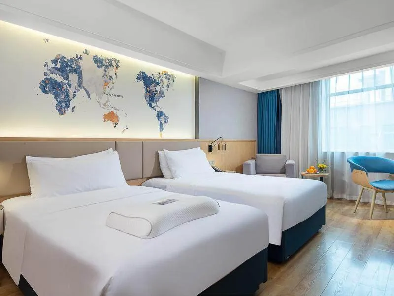 Bed in Kyriad Marvelous Hotel Dongguan Changan Light Rail Station