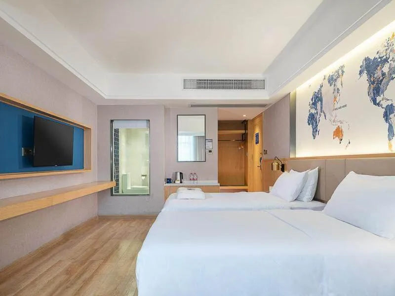 Bed in Kyriad Marvelous Hotel Dongguan Changan Light Rail Station