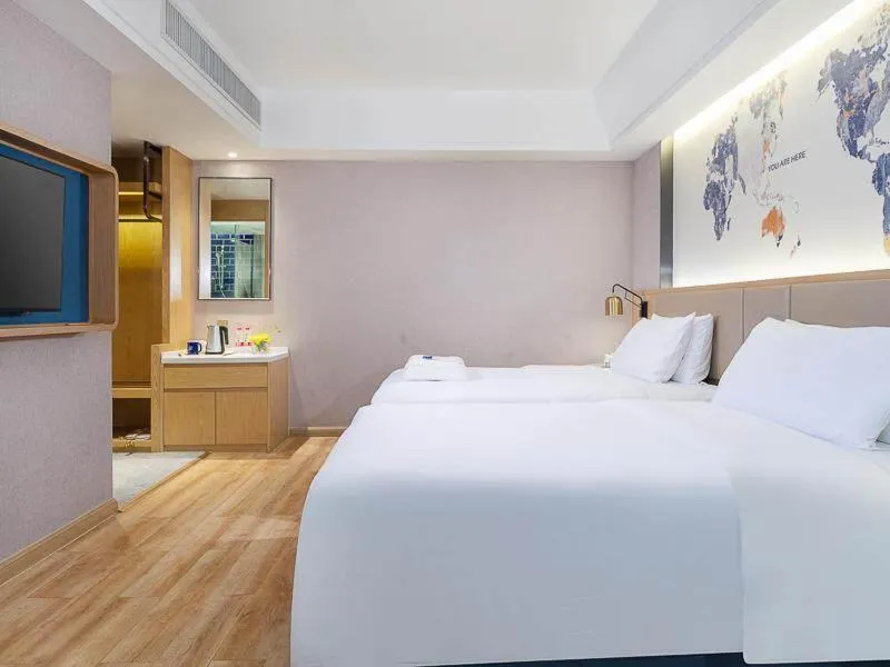 Bed in Kyriad Marvelous Hotel Dongguan Changan Light Rail Station
