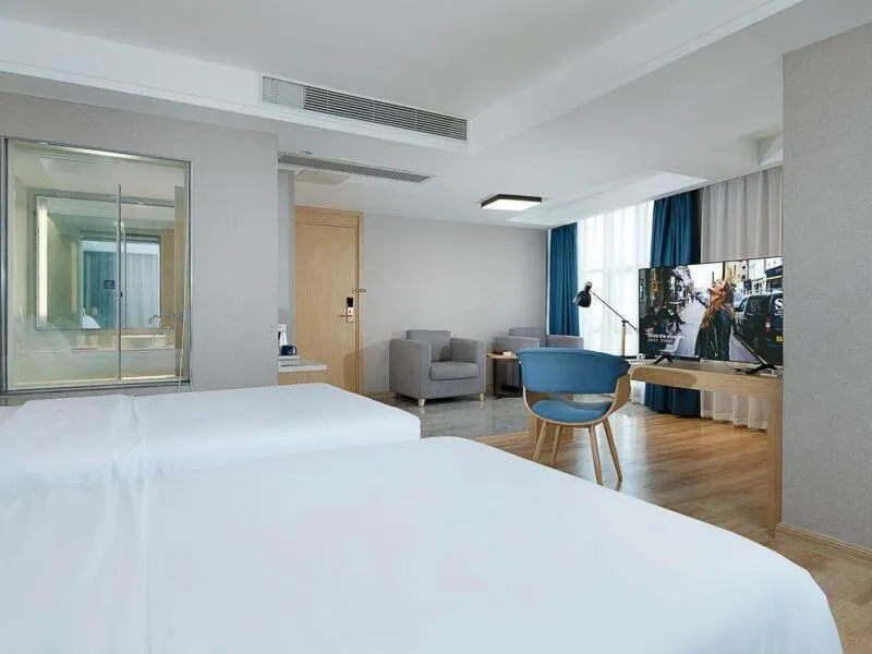 Bed in Kyriad Marvelous Hotel Dongguan Changan Light Rail Station