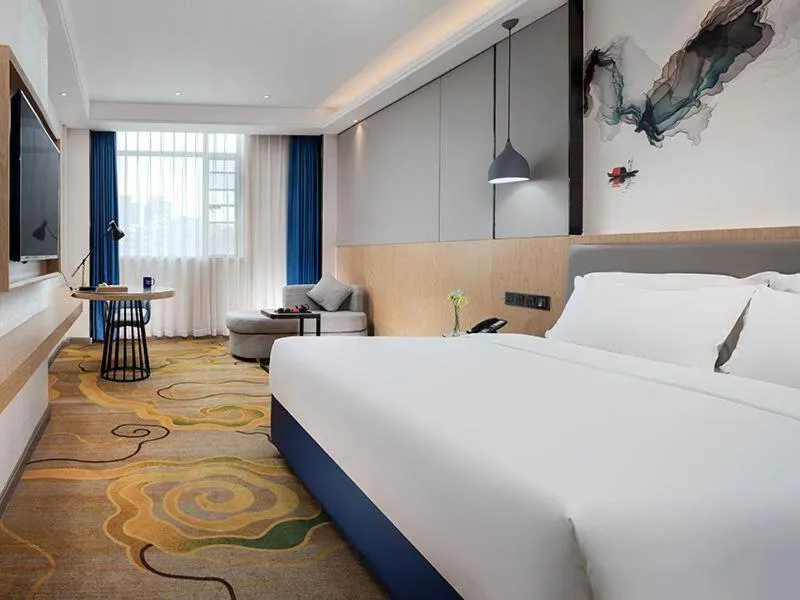 Bed in Kyriad Marvelous Hotel Shenzhen North Railway Station Yousong