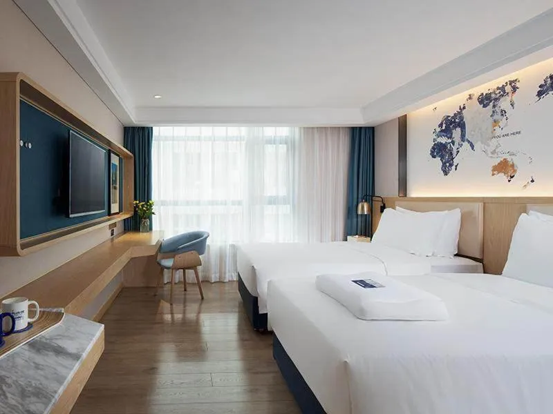 Bed in Kyriad Marvelous Hotel Shenzhen Longhua Dalang Business Center