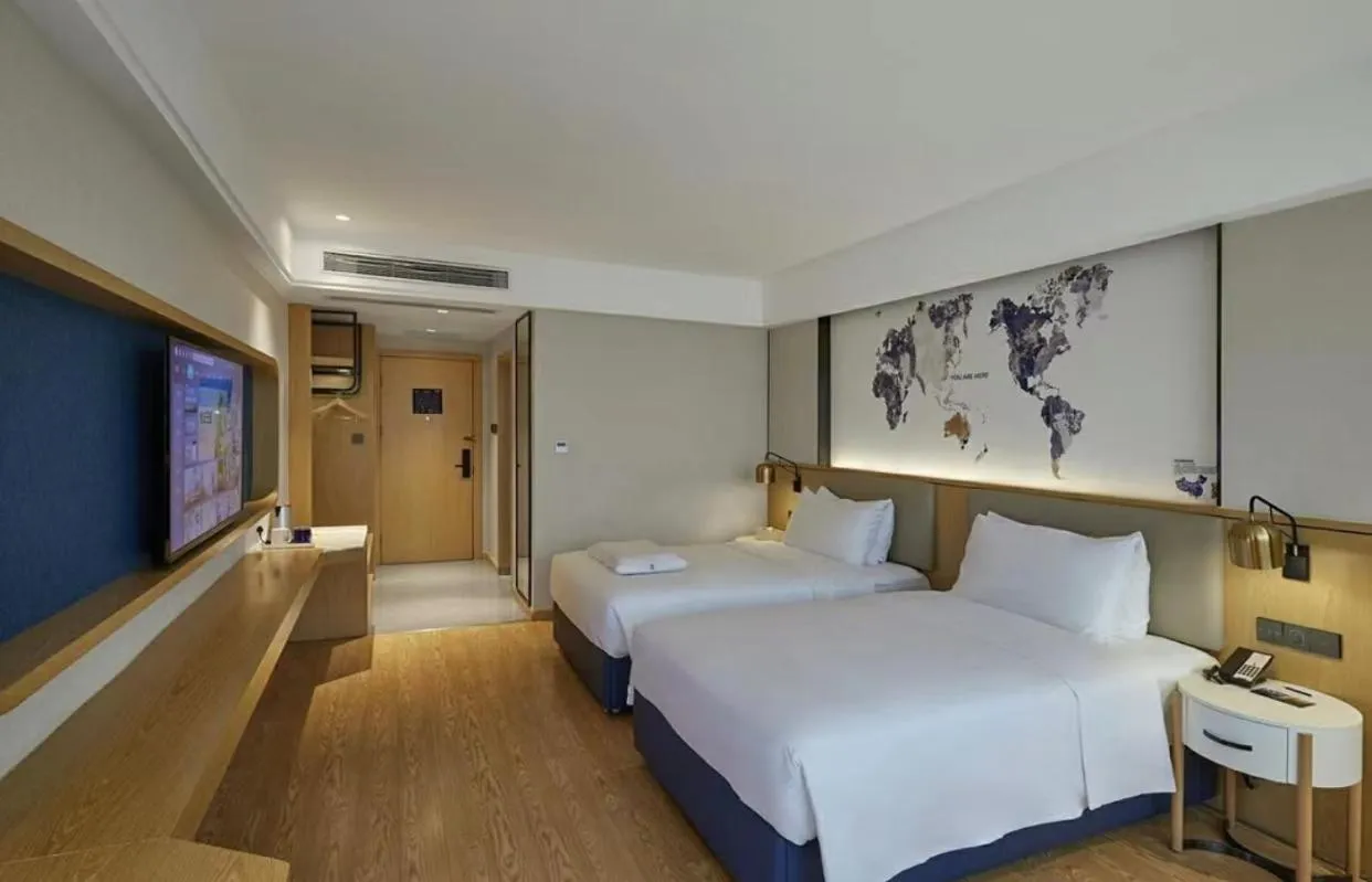 Bed in Kyriad Marvelous Hotel Shenzhen Longhua Dalang Business Center