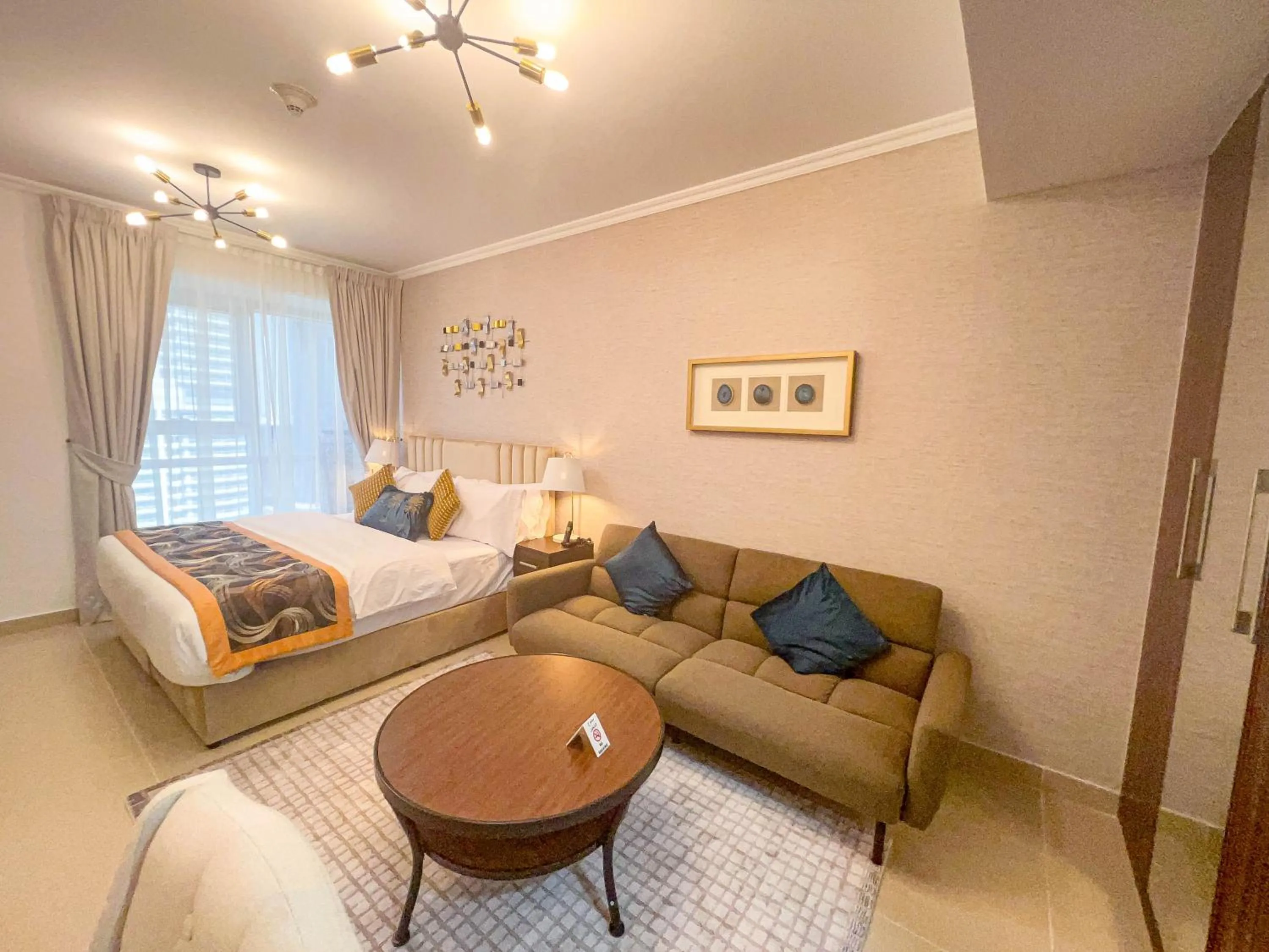 Bed in Cosmos Living Luxurious Studio Near Metro