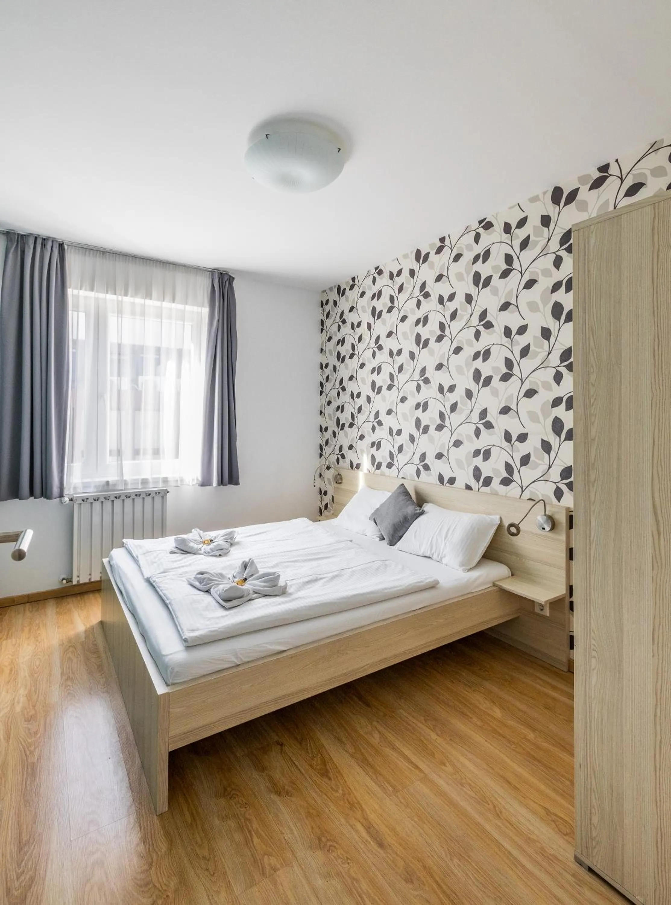 Bed in Maple Tree Budget Apartments