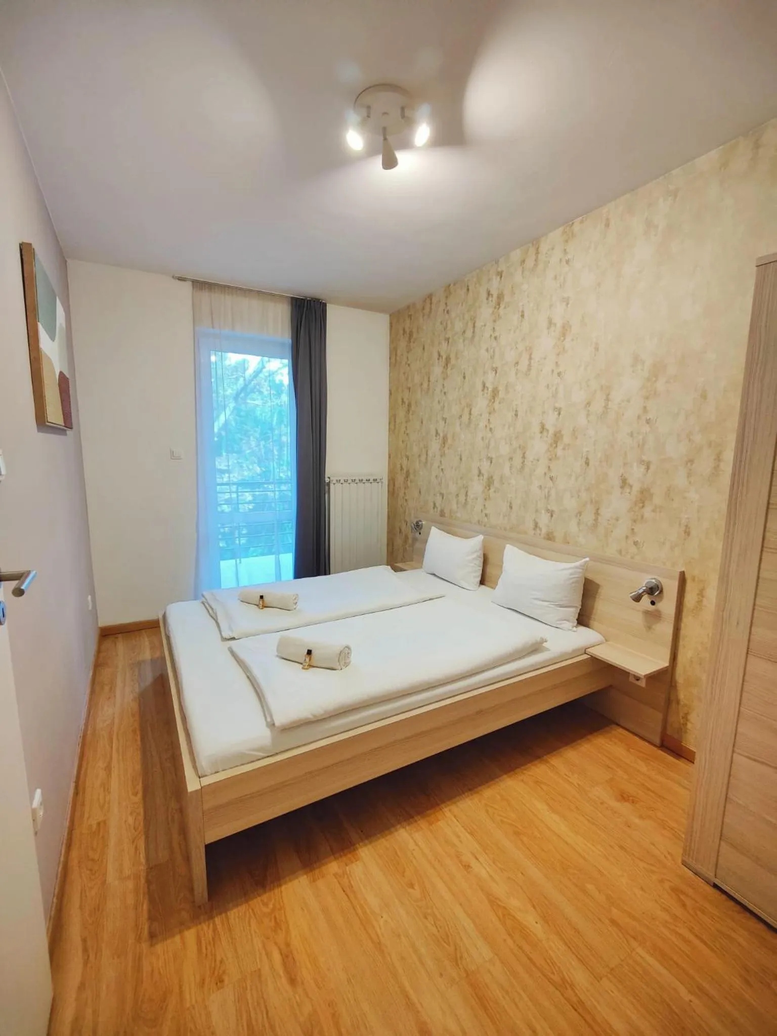 Bed in Maple Tree Budget Apartments