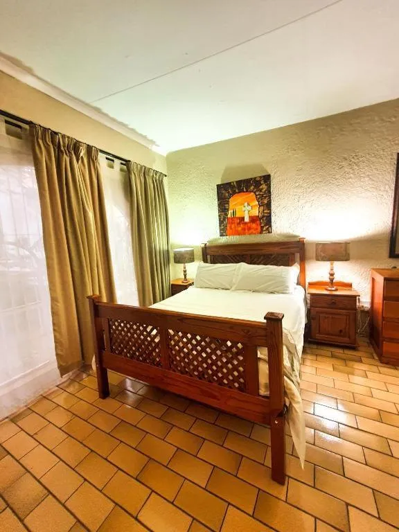 Bed in Just Tiffany Guest House & Conference Facility