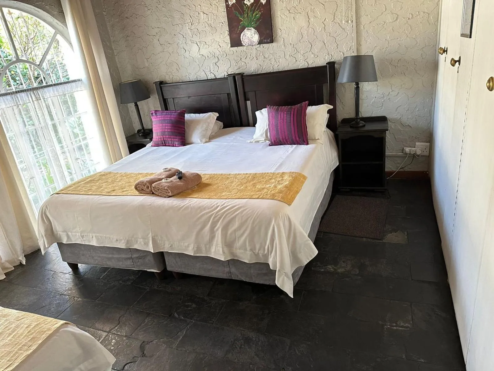 Bed in Just Tiffany Guest House & Conference Facility