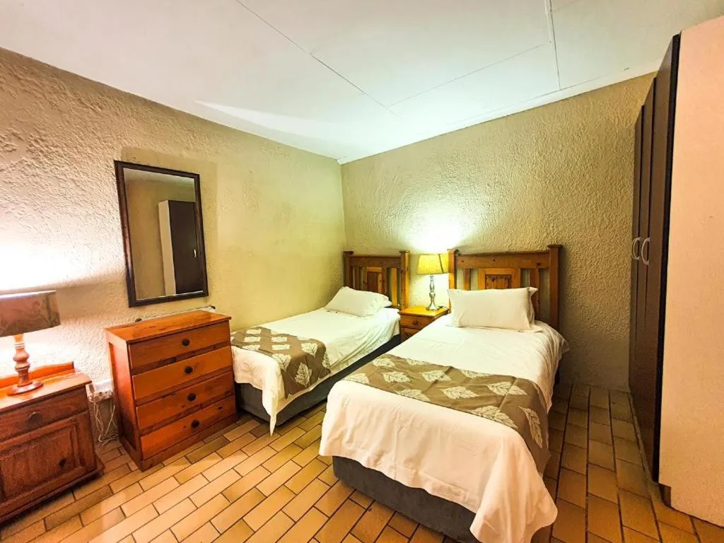 Bed in Just Tiffany Guest House & Conference Facility