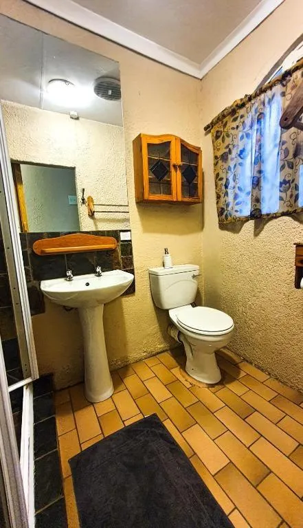 Toilet in Just Tiffany Guest House & Conference Facility