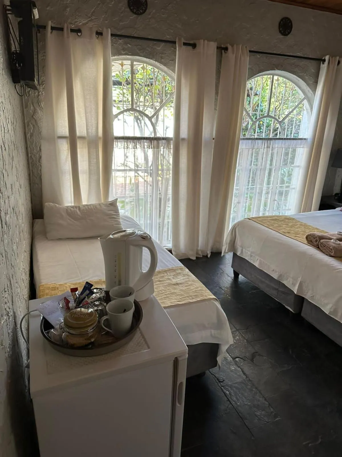 Bed in Just Tiffany Guest House & Conference Facility