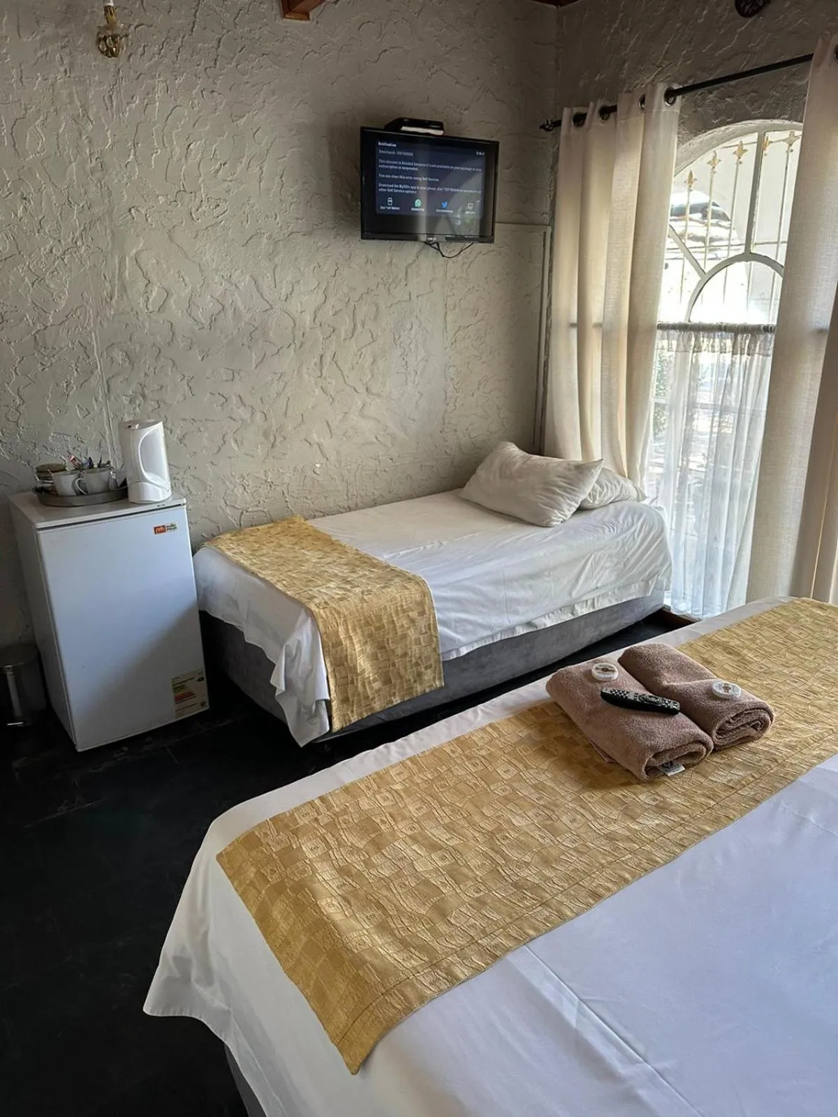 Bed in Just Tiffany Guest House & Conference Facility