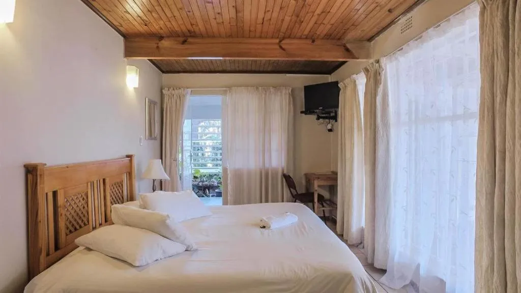 Bed in Just Tiffany Guest House & Conference Facility