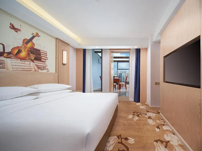 Bed in Vienna International Hotel Chongqing Yuanyangyuanboyuan