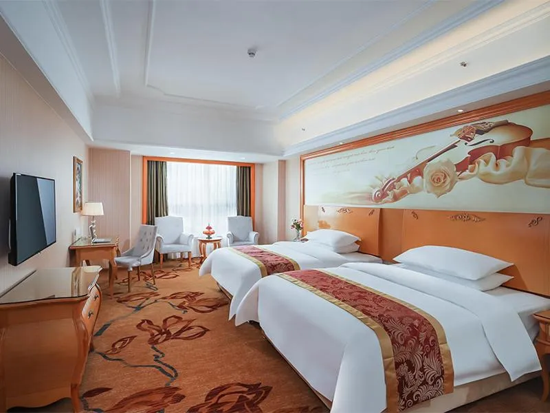Bed in Vienna International Hotel Wuxi Huishan Yanqiao Metro Station