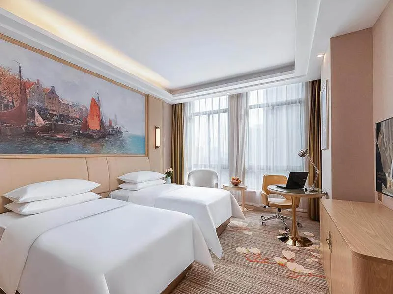 Bed in Vienna Hotel Danyang Glasses City High Speed Railway Station Dabo