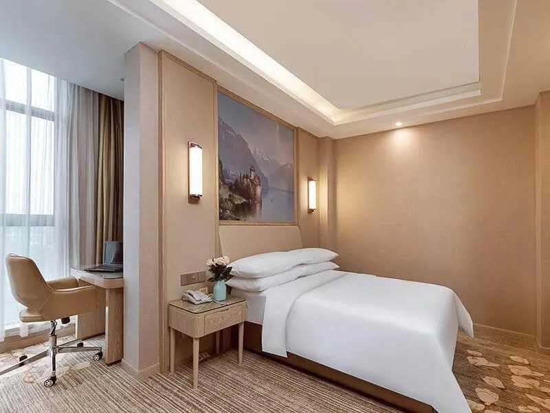 Bed in Vienna Hotel Danyang Glasses City High Speed Railway Station Dabo