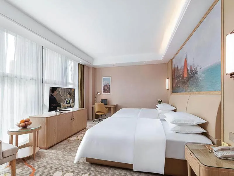 Bed in Vienna Hotel Danyang Glasses City High Speed Railway Station Dabo
