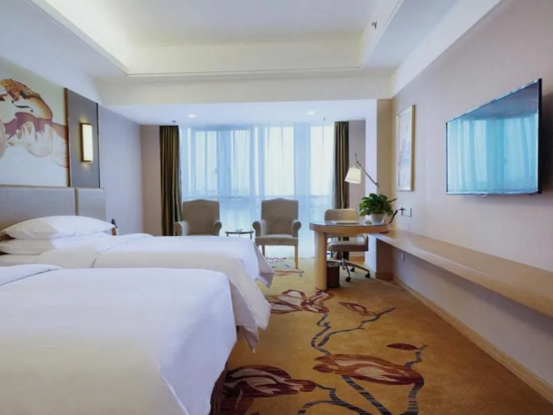 Bed in Vienna International Hotel Nanjing Dongshan Headquarters