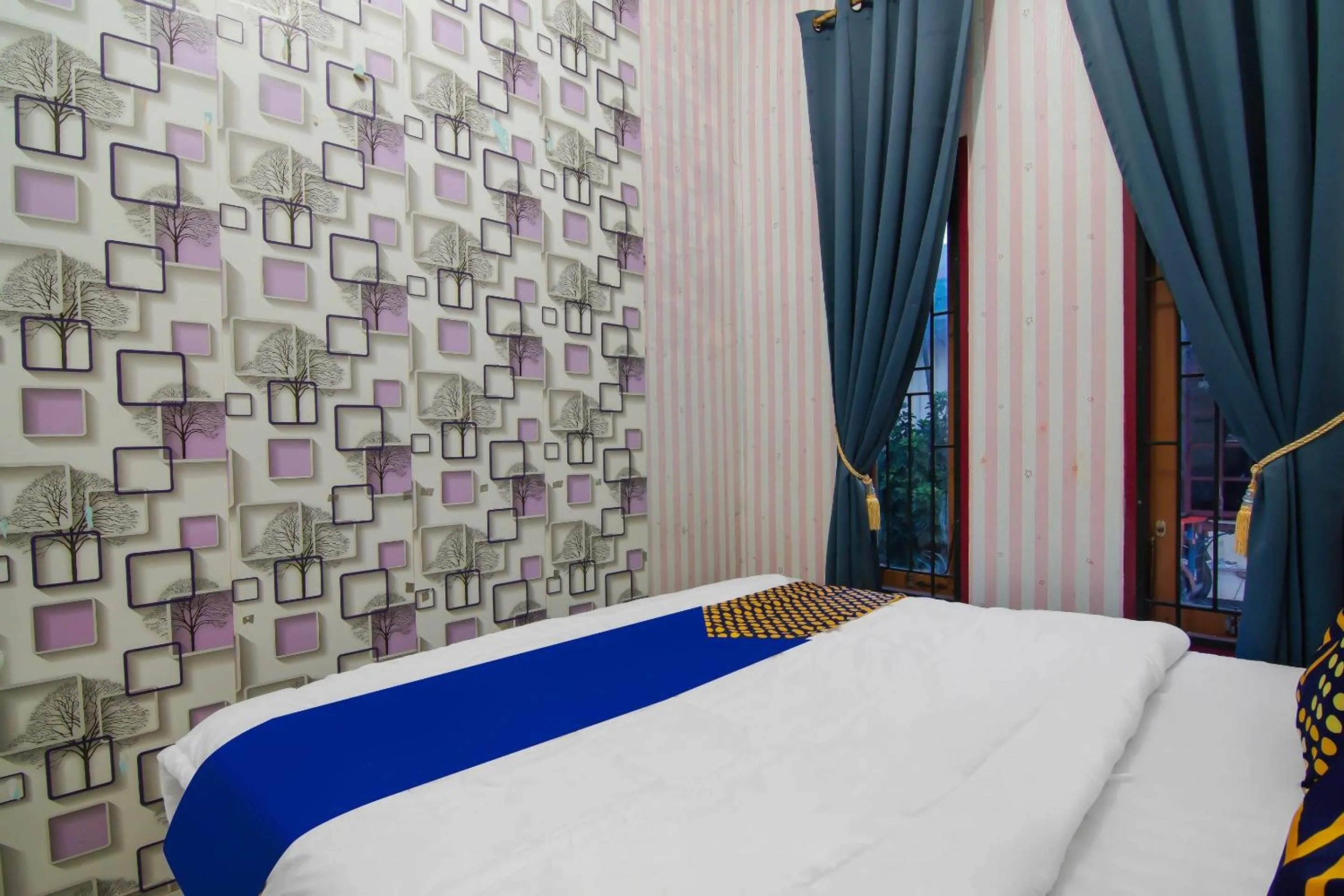 Bedroom, Bed in Hotel O Putri Guest House Syariah Near SPBU Rimbo Panjang