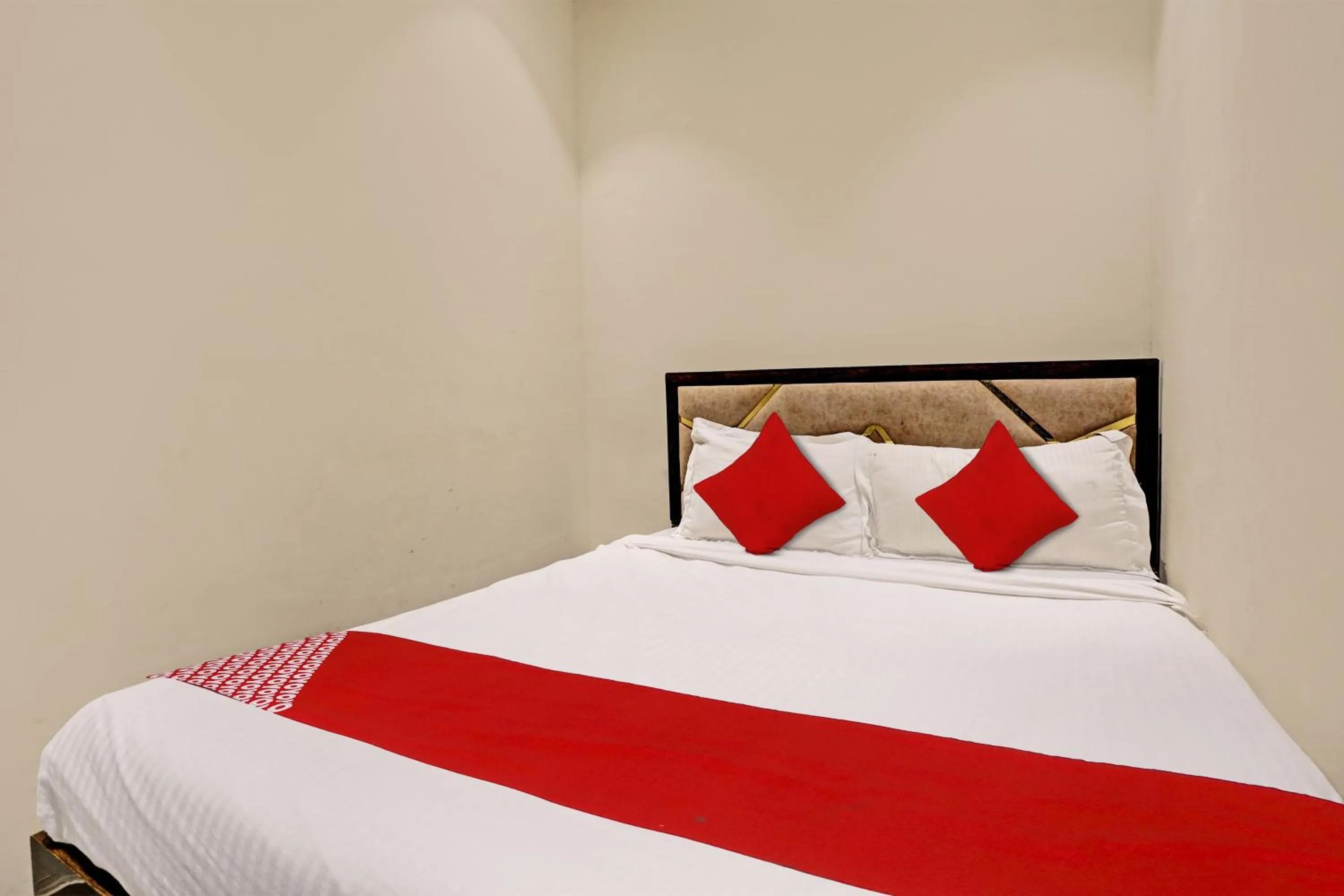 Bedroom in Hotel O NK Grand