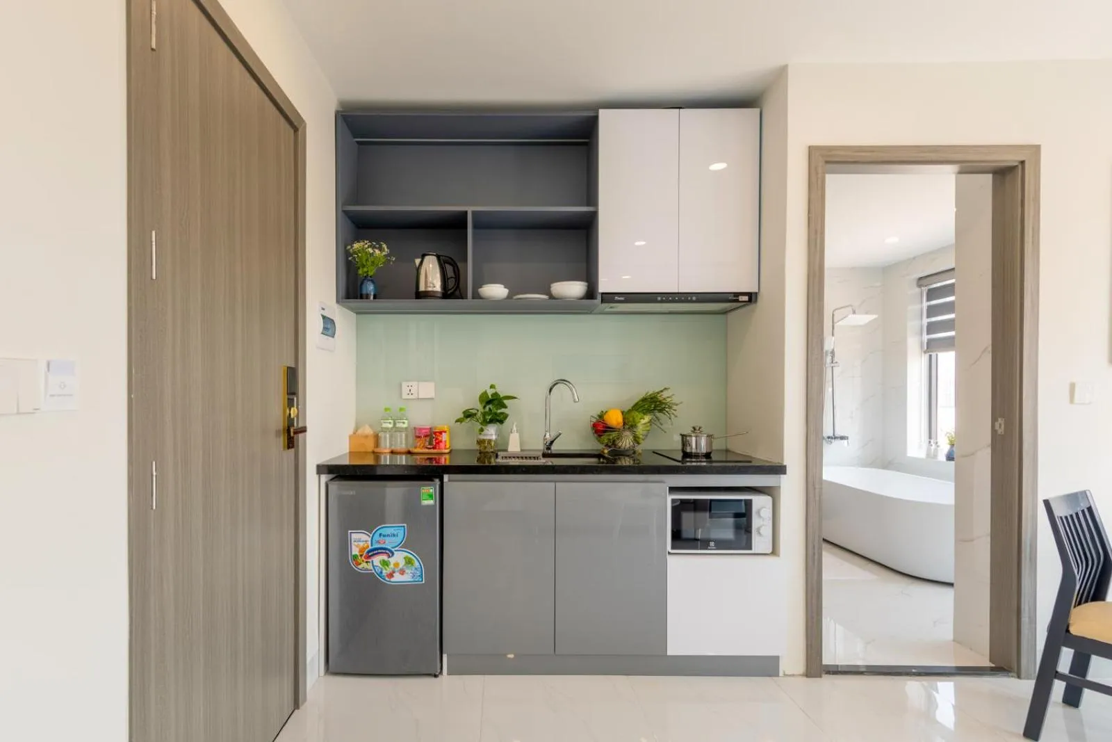 Kitchen or kitchenette in The Home Hotel & Apartment