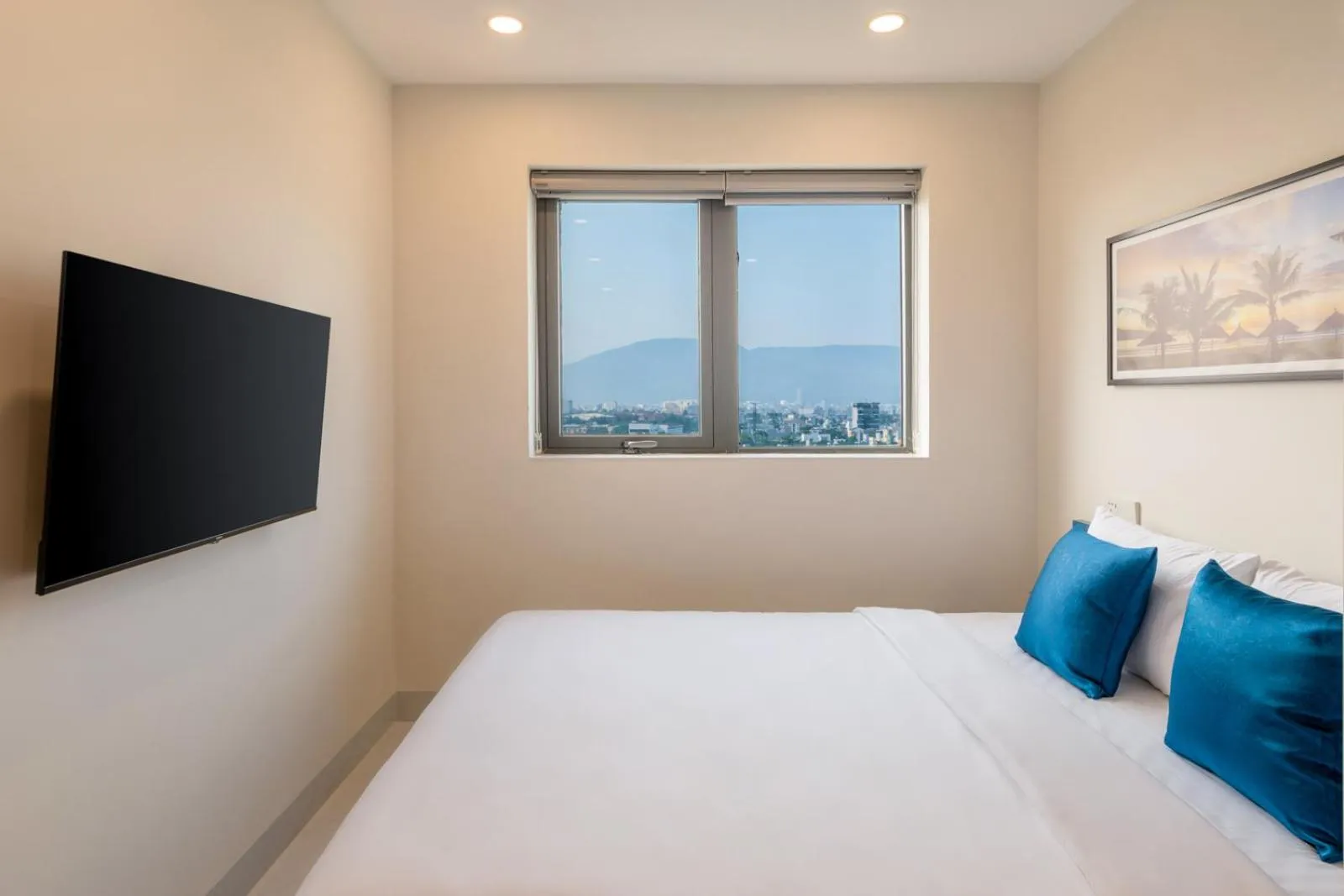 Bed in The Home Hotel & Apartment