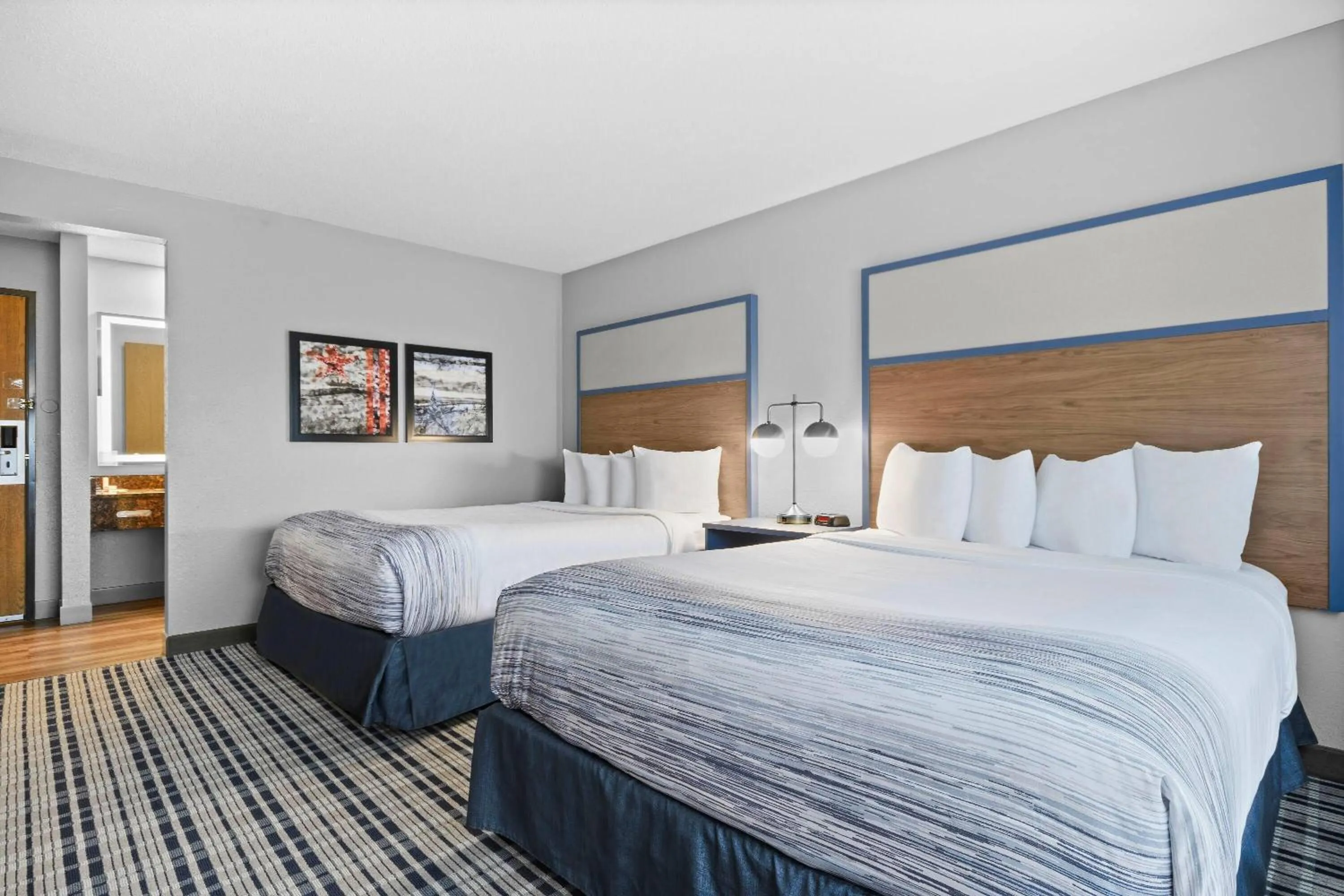 Bed in AmericInn by Wyndham Virginia