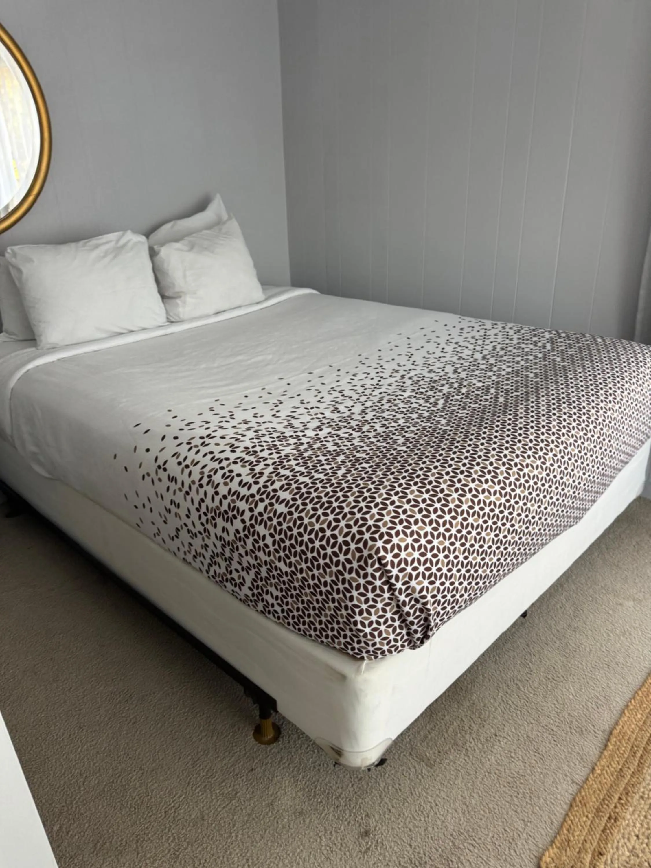 Bed in Knotty Pine Motel