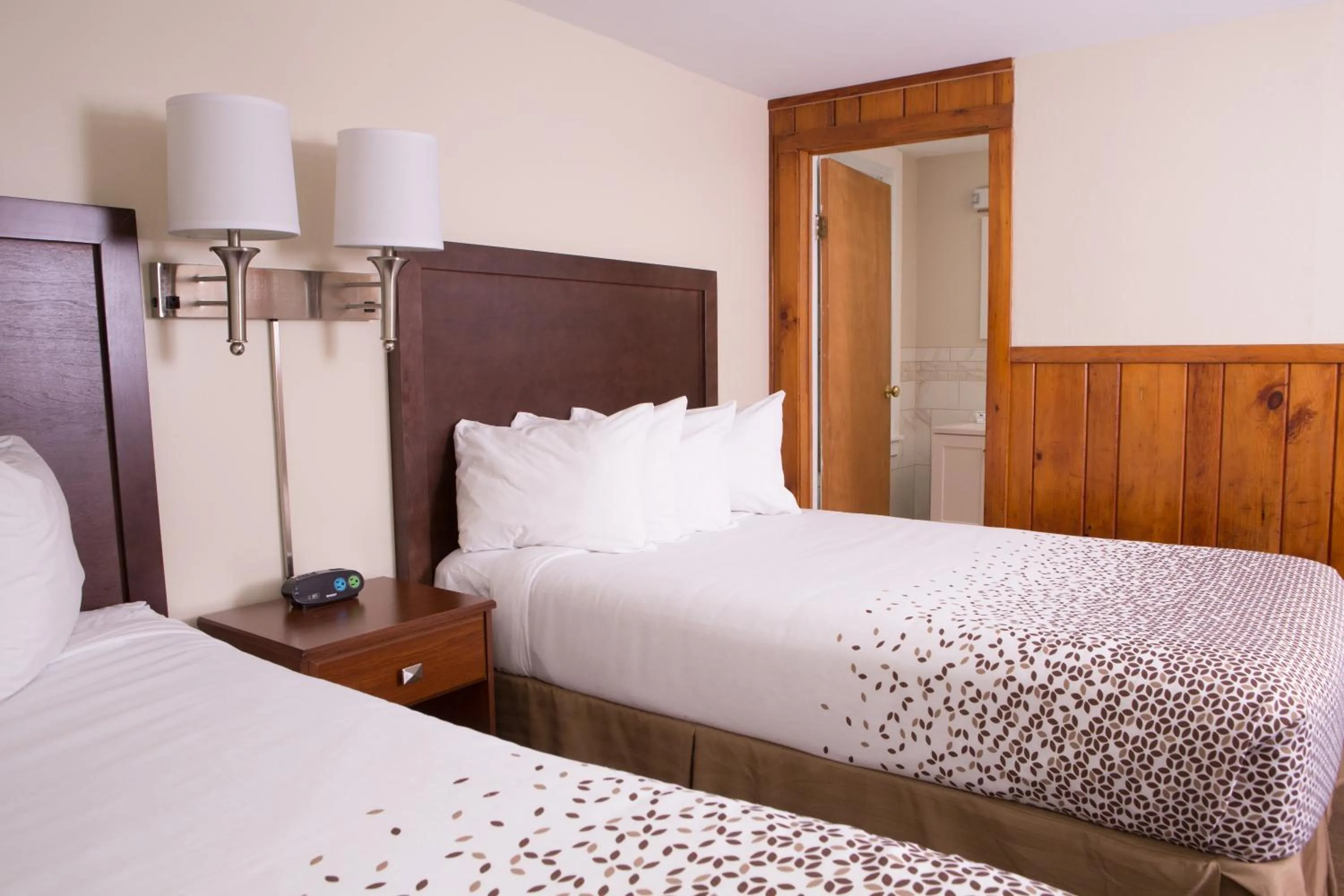 Bed in Knotty Pine Motel