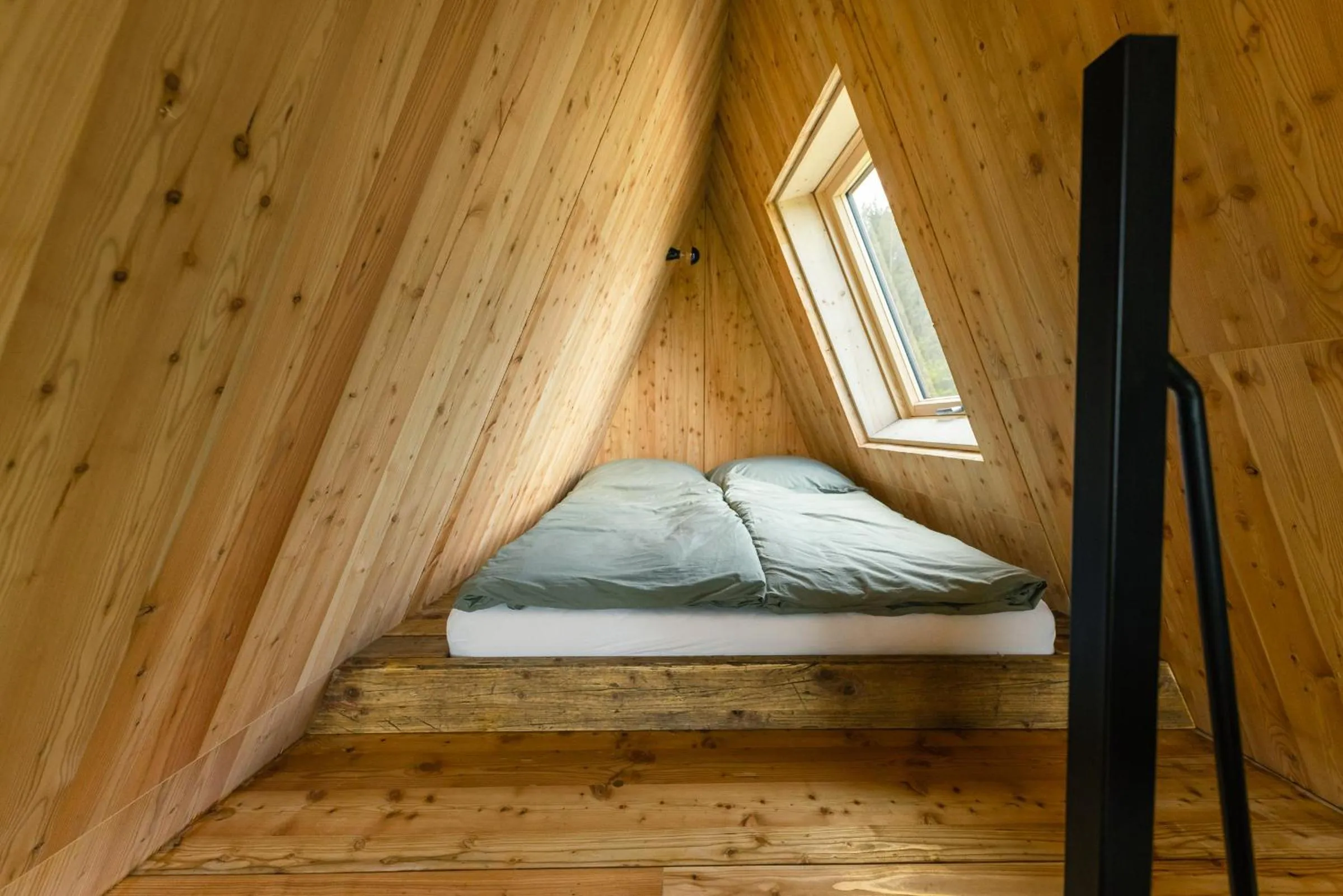 Bed in Baumhausapartment