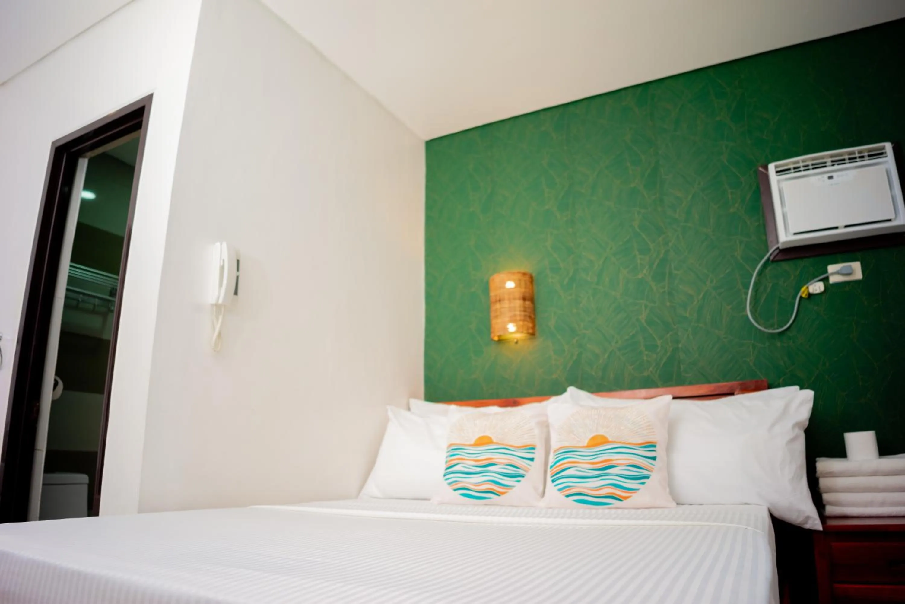 Bed in DENGI INN EL NIDO