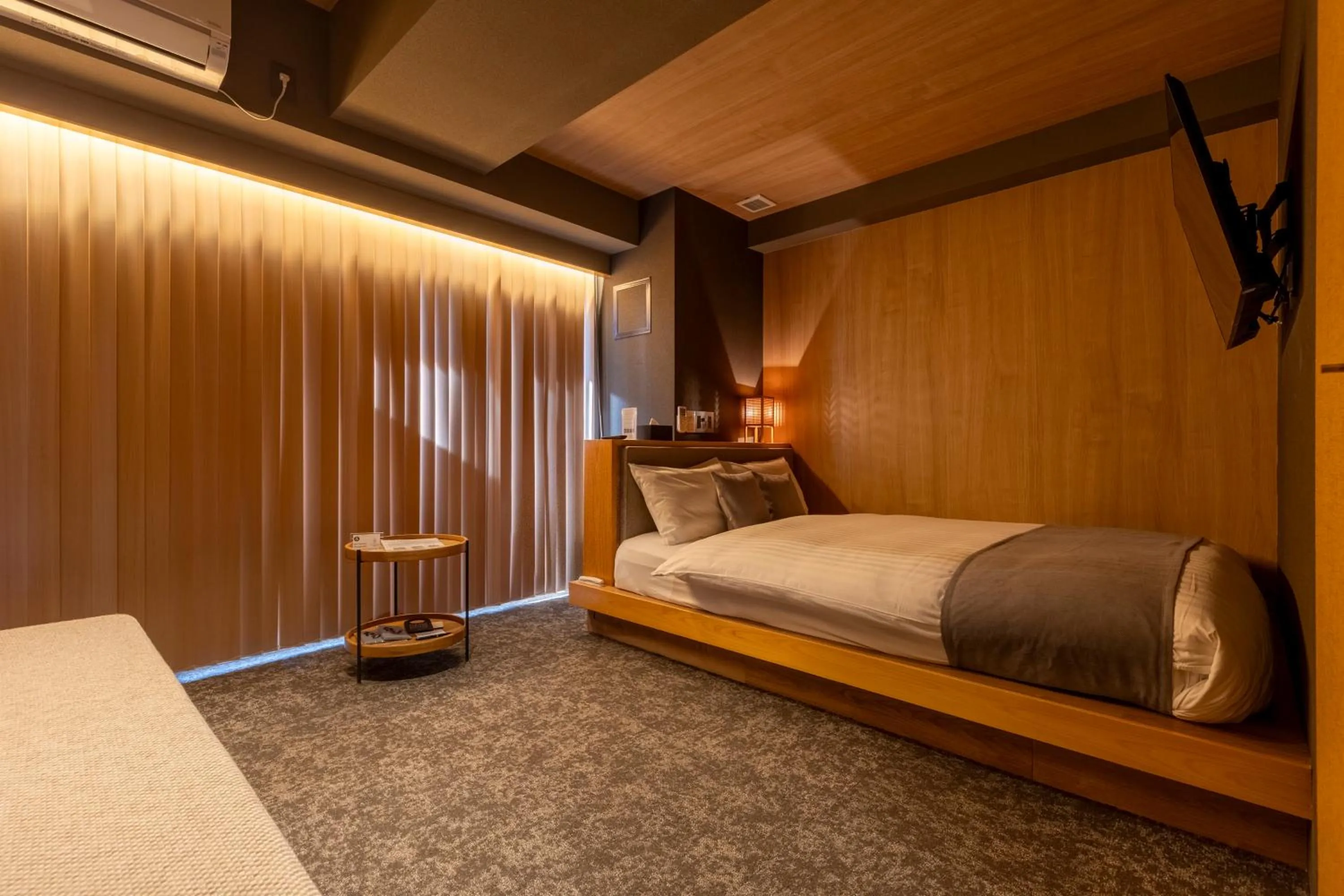 Bed in HOTEL TOMOS ASAKUSA