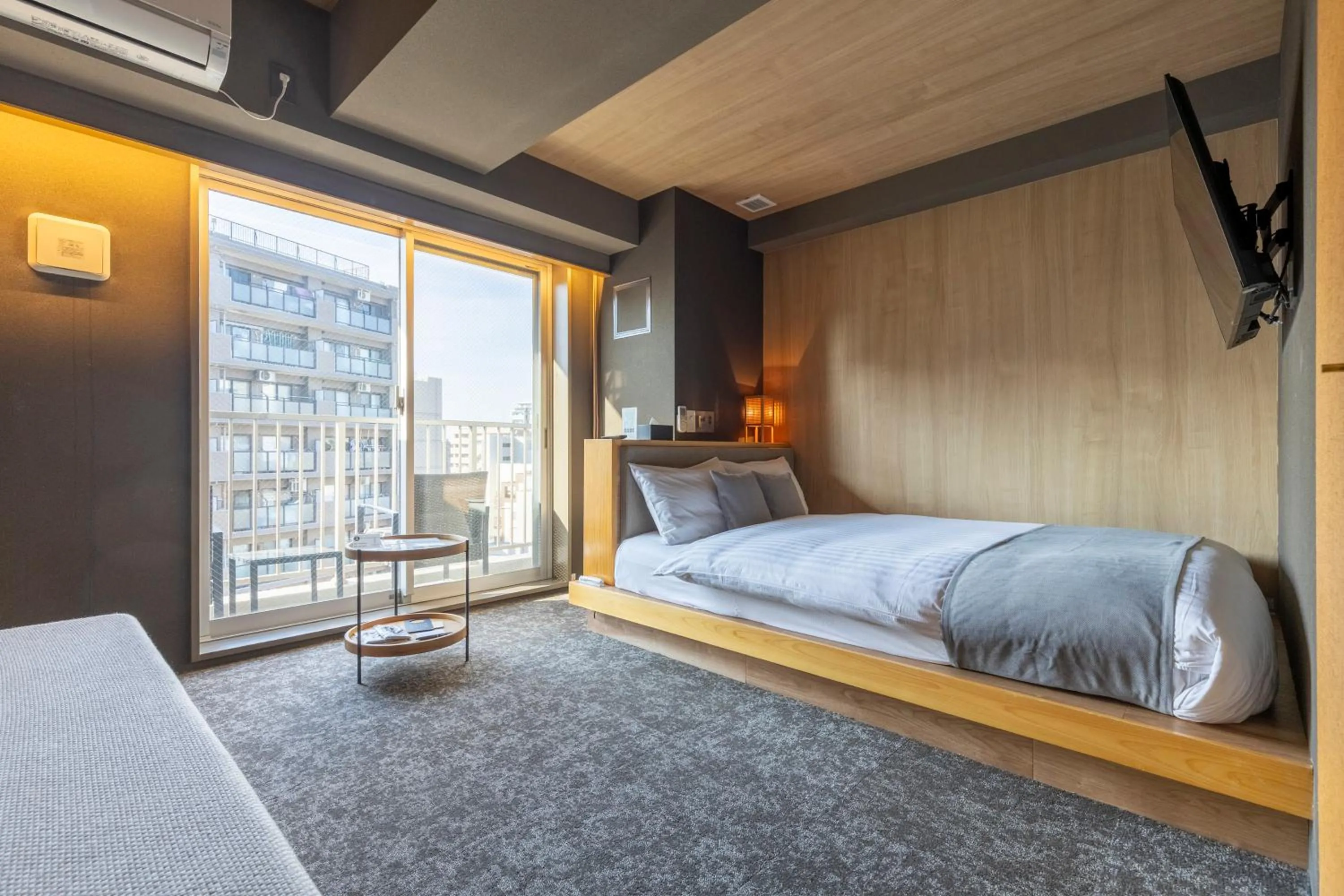 Bed in HOTEL TOMOS ASAKUSA