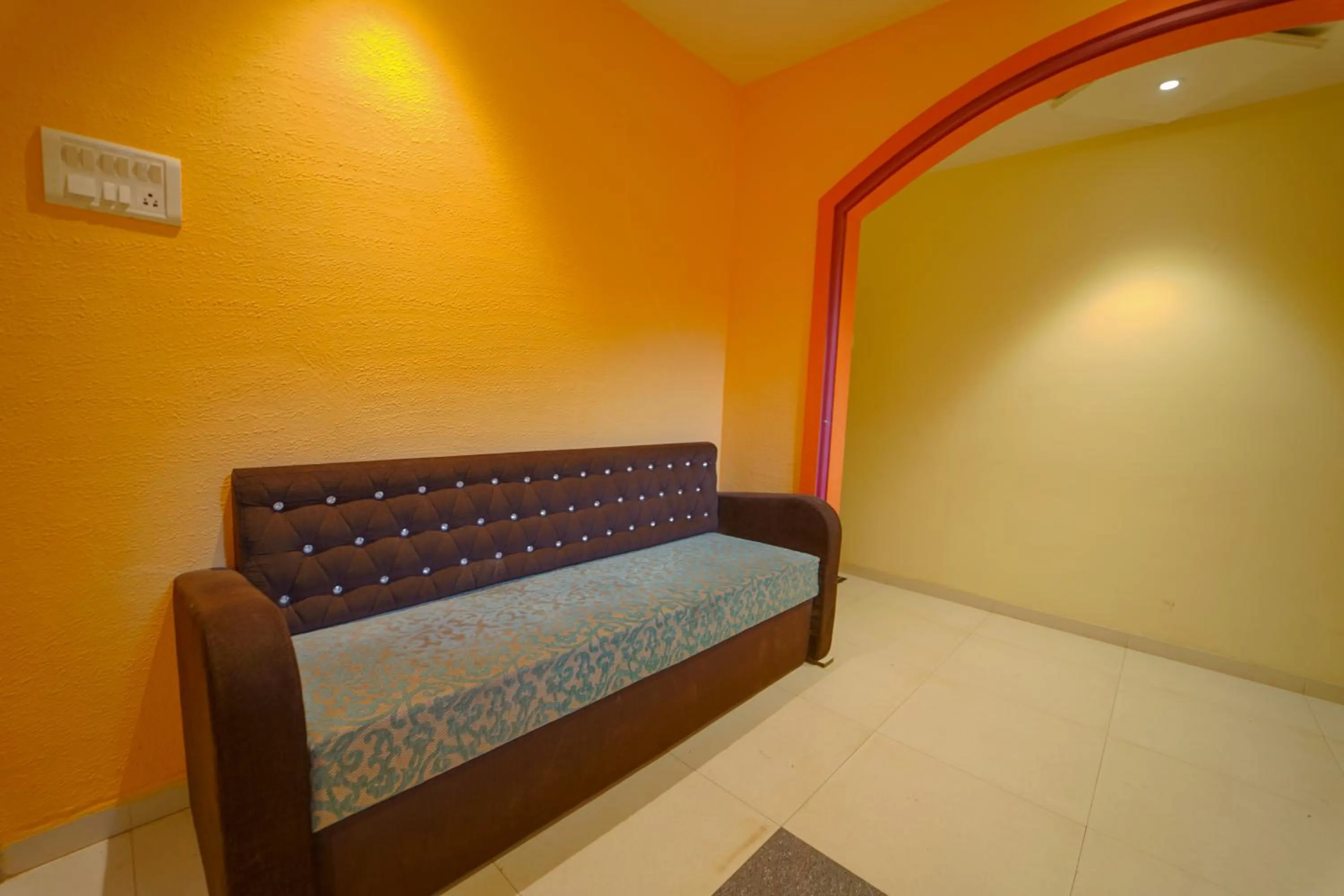 Seating area, Bed in Veggies Residency