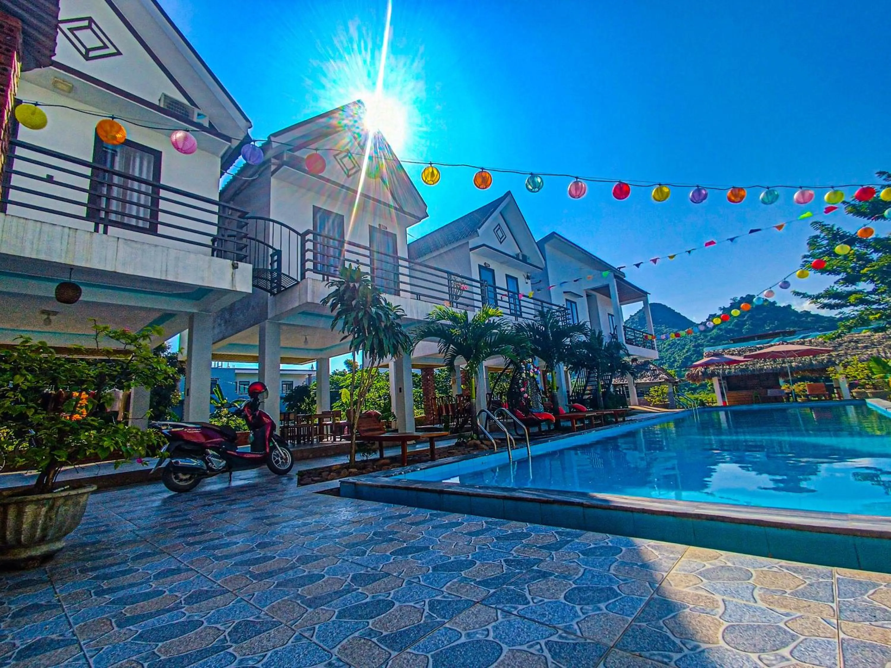 Swimming pool in YoLo Pool Bar Villas & Garden Restaurant